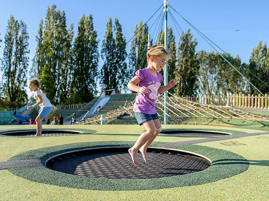 girls on playground trampolines