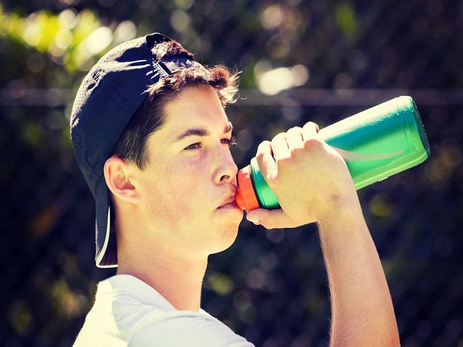 teen with water bottle