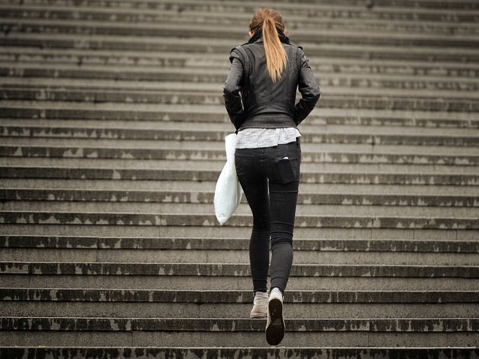 woman climbing stairs