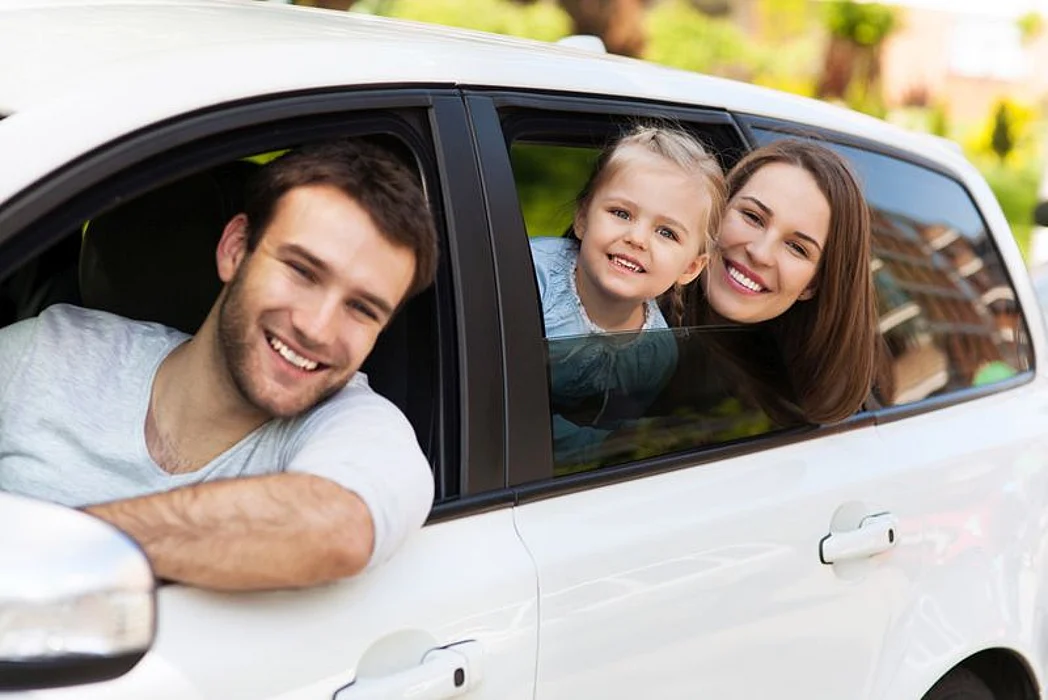 family in car