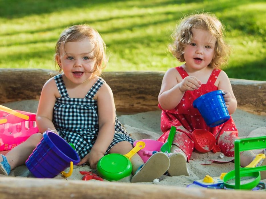toddlers in sandbox