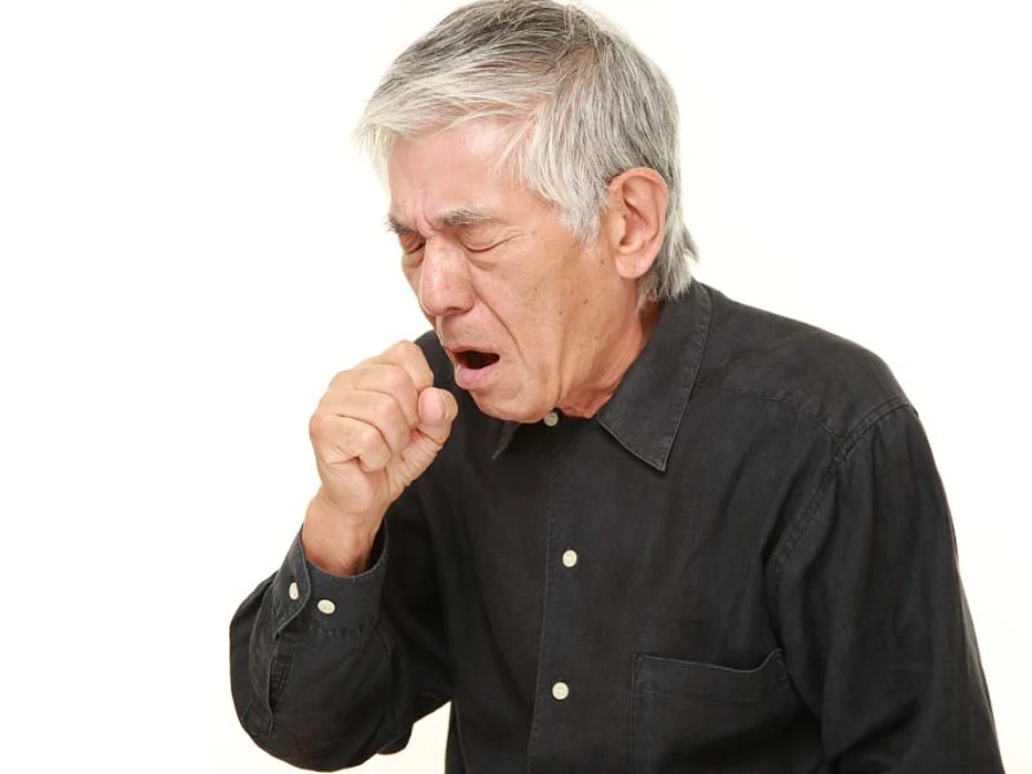 man coughing