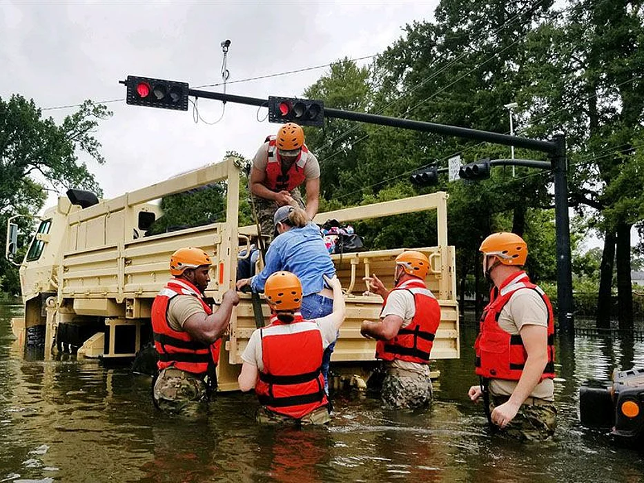 Texas National Guardsmen assist residents affected by flooding caused by Hurricane Harvey