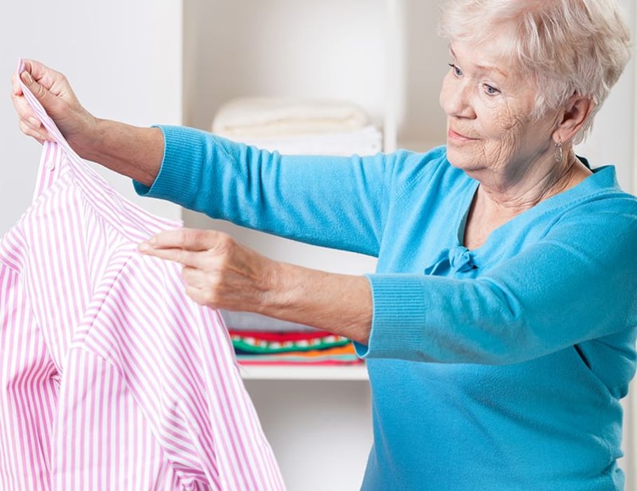 woman folding laundry