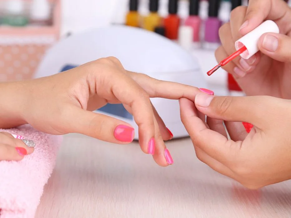 woman getting manicure