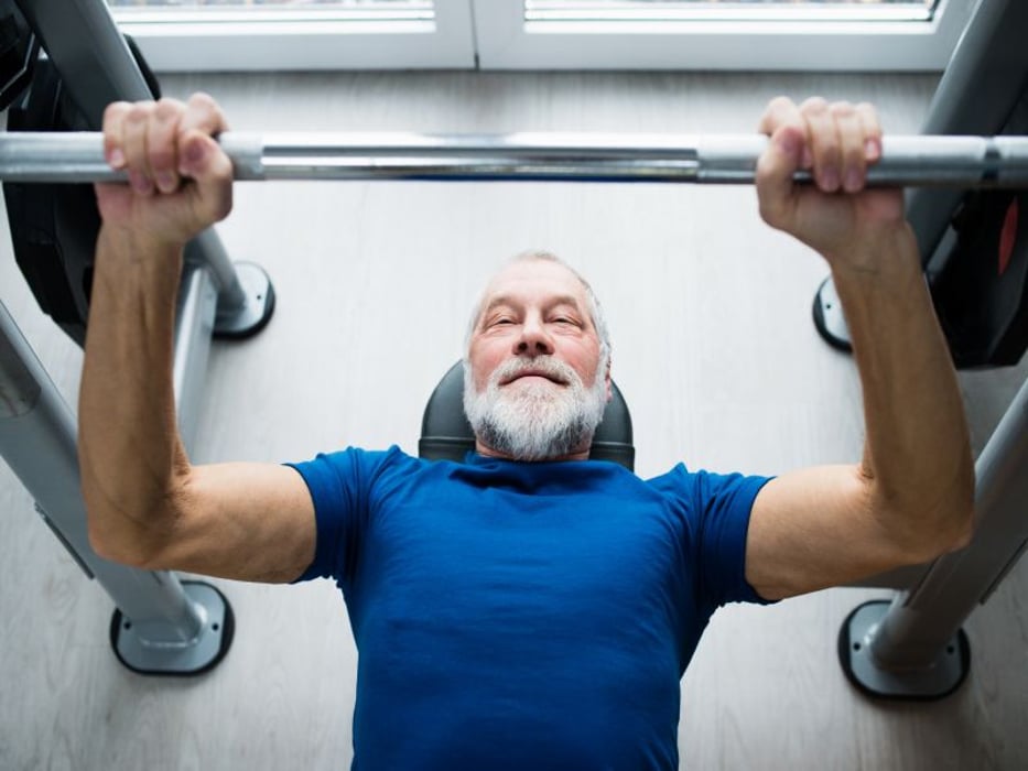 senior man lifting weights