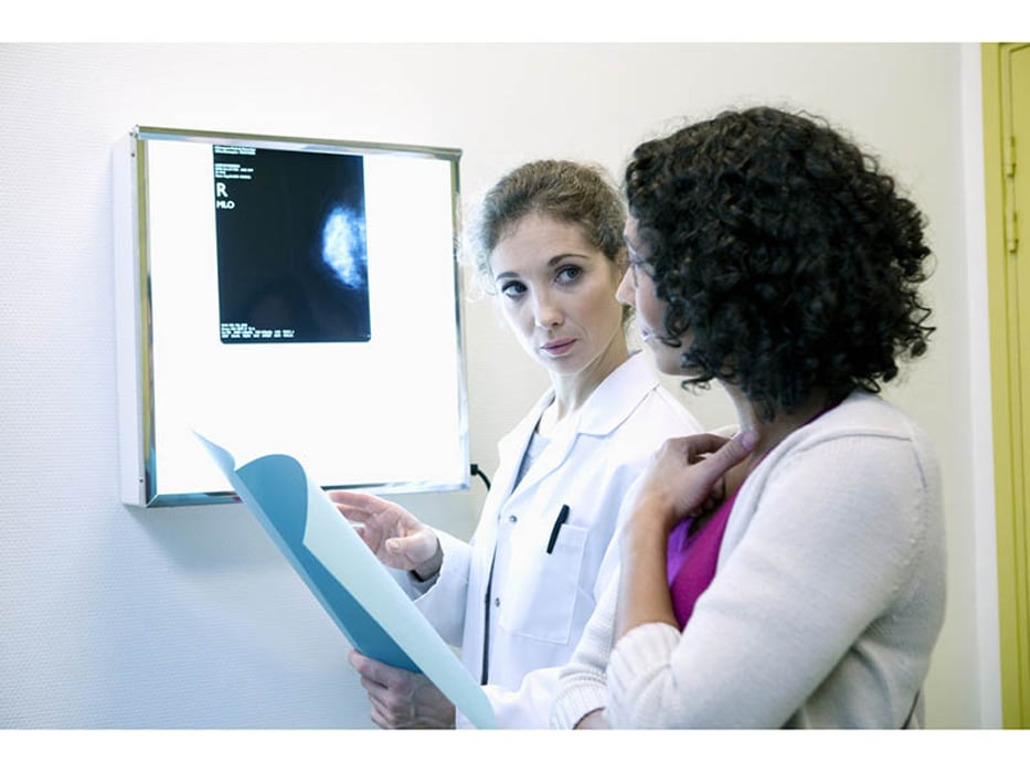 doctor and woman reviewing mammogram