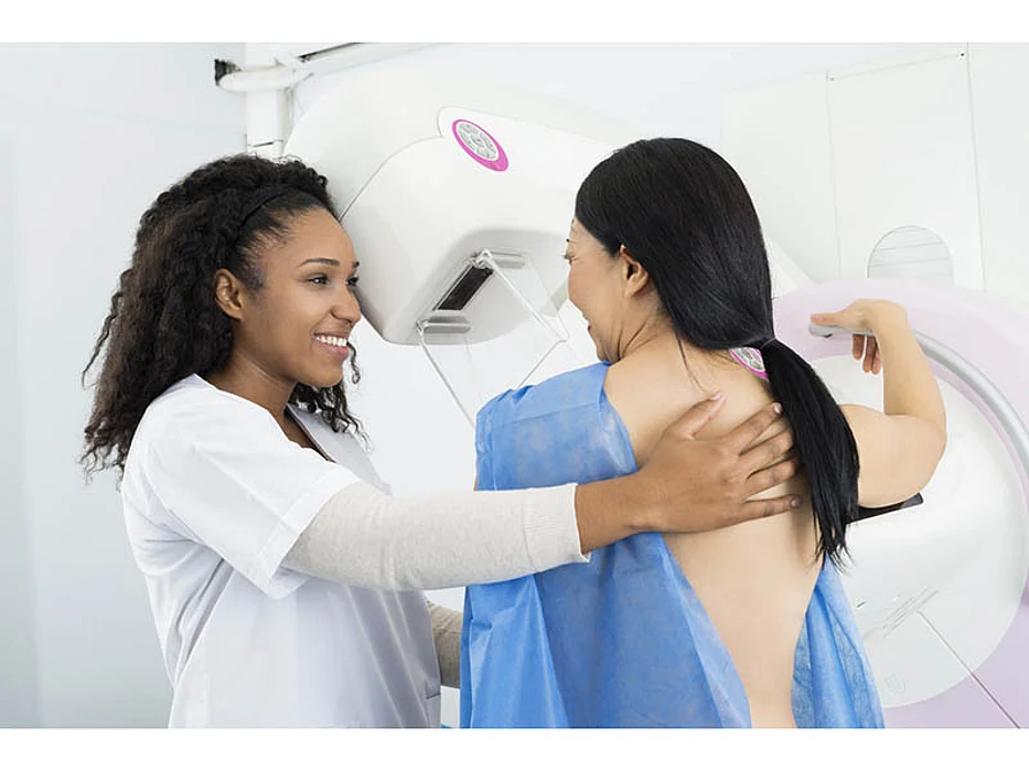 asian woman getting mammogram