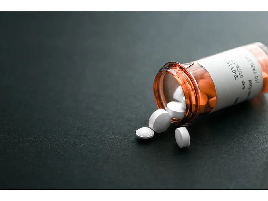 bottle with pills spilled out of it