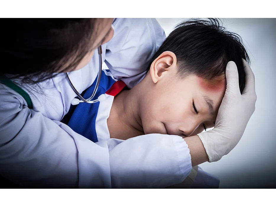 a boy with a head injury