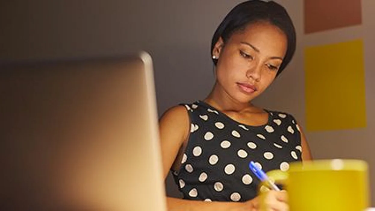 woman sitting in front of the computer
