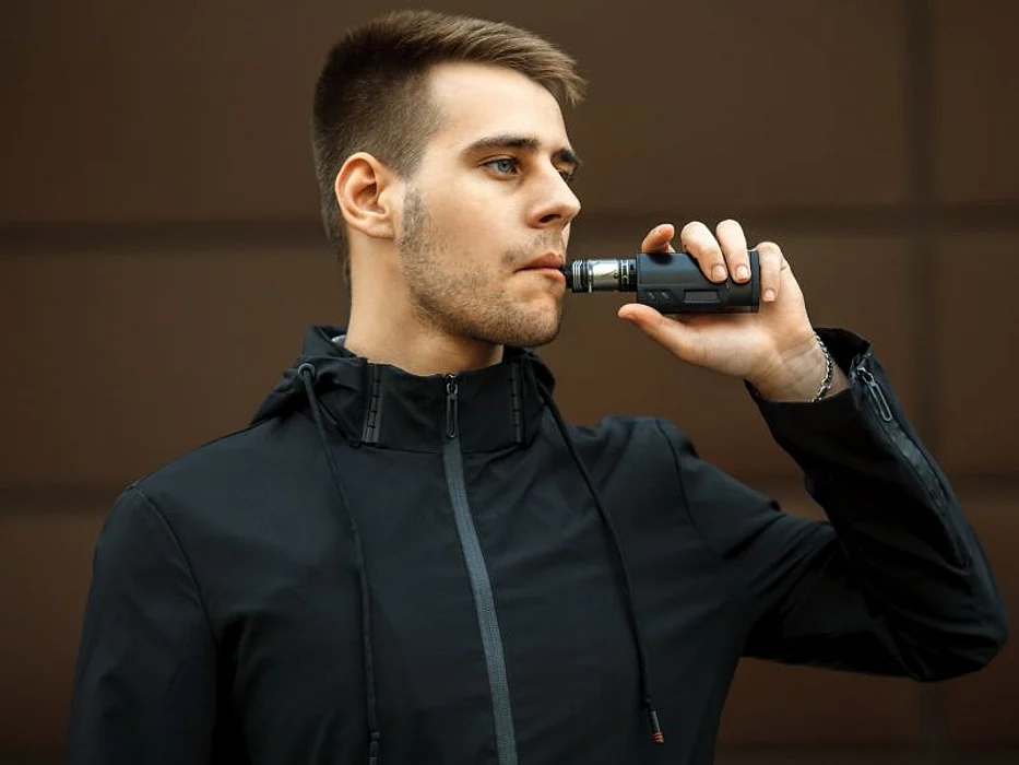 Man vaping e-cigarette