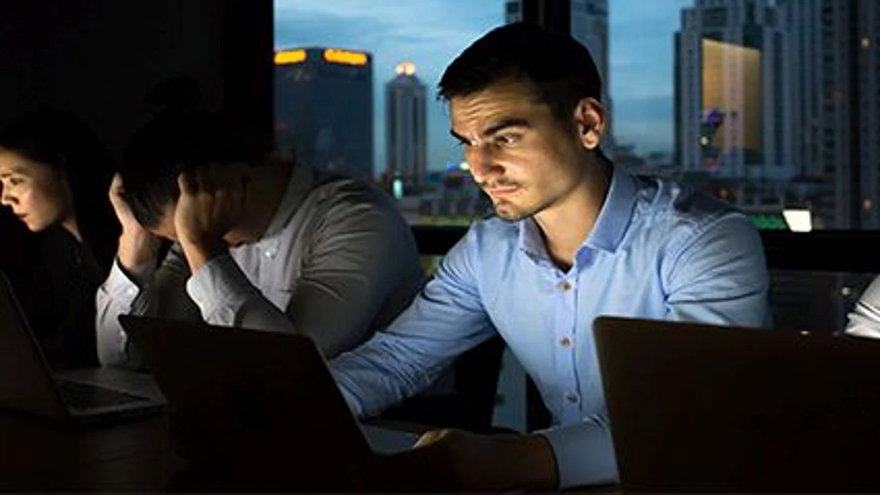 people sitting in front of the computer