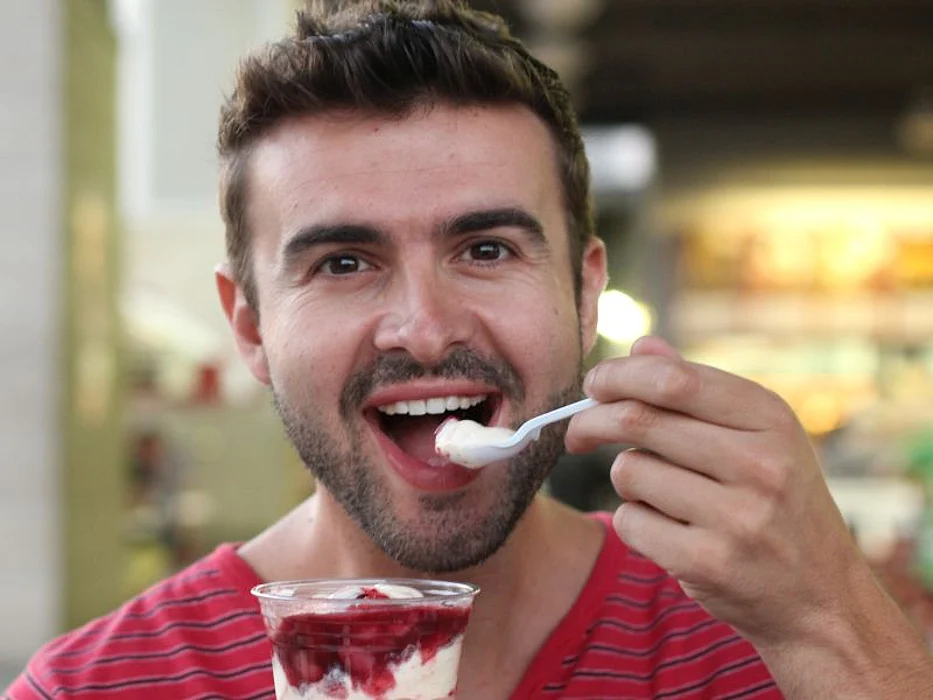 Man eating yogurt