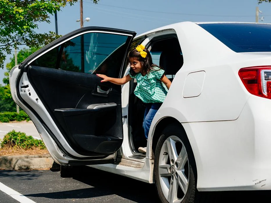girl exiting car