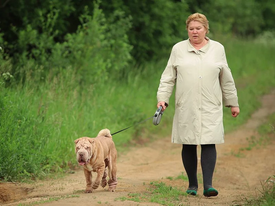 Overweight woman and dog