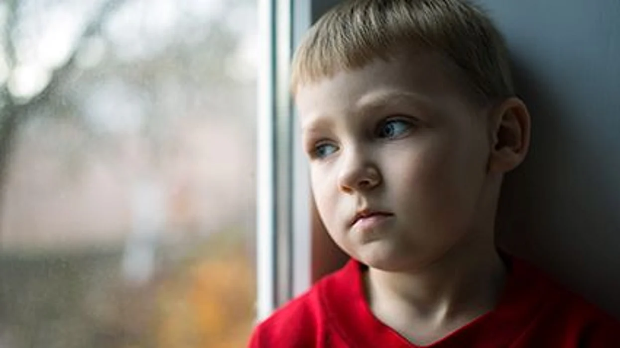 a boy looking sad