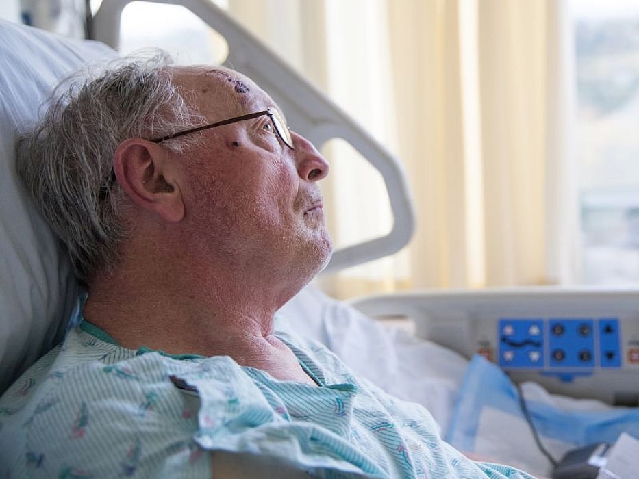 man in hospital bed