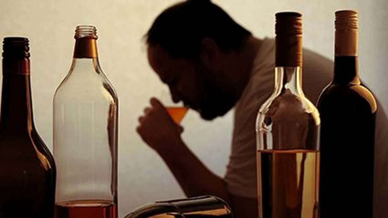 a man drinking alcohol