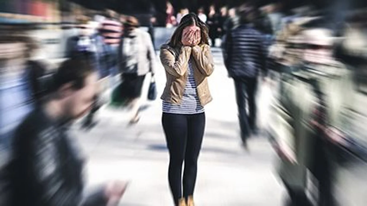 a girl inooking stressed in the crawd