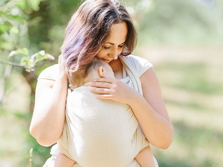 mother and infant in carrier