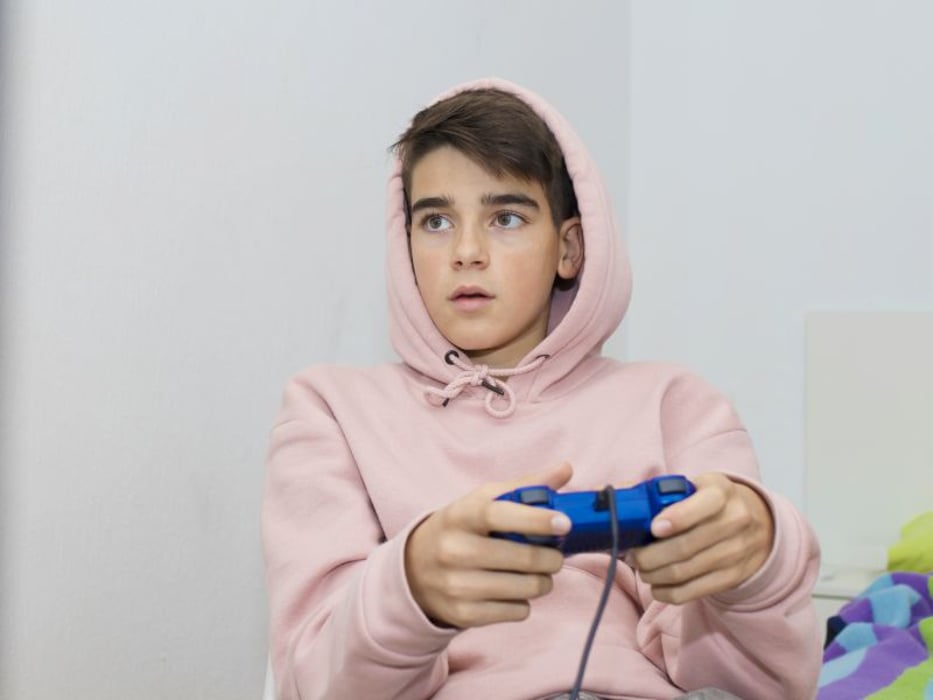Teen playing video game