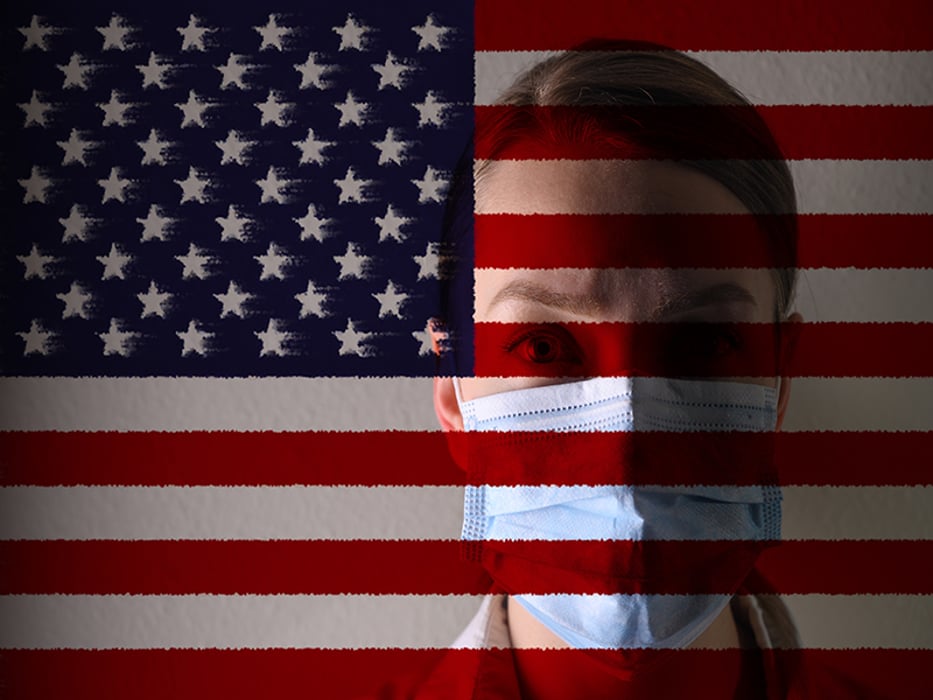 a person in a surgical mask over the face against the background of the USA flag