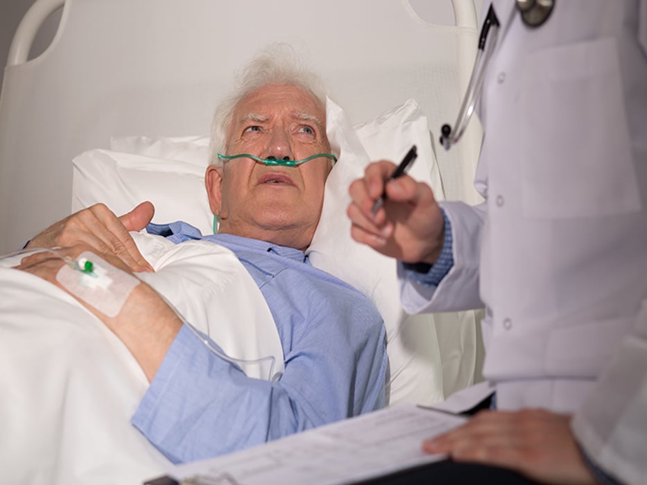 eldery man examined by a doctor