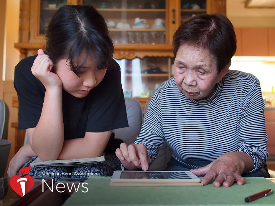 older lady sitting at the table with a younger girl