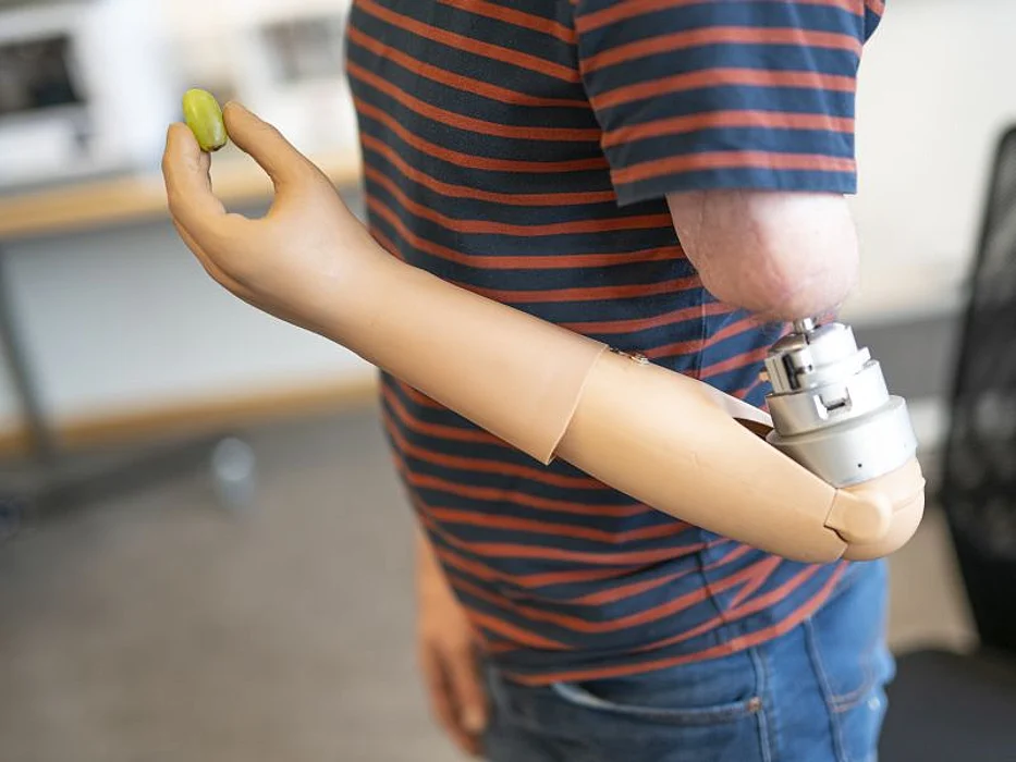 Patient using neuromusculoskeletal prosthesis.