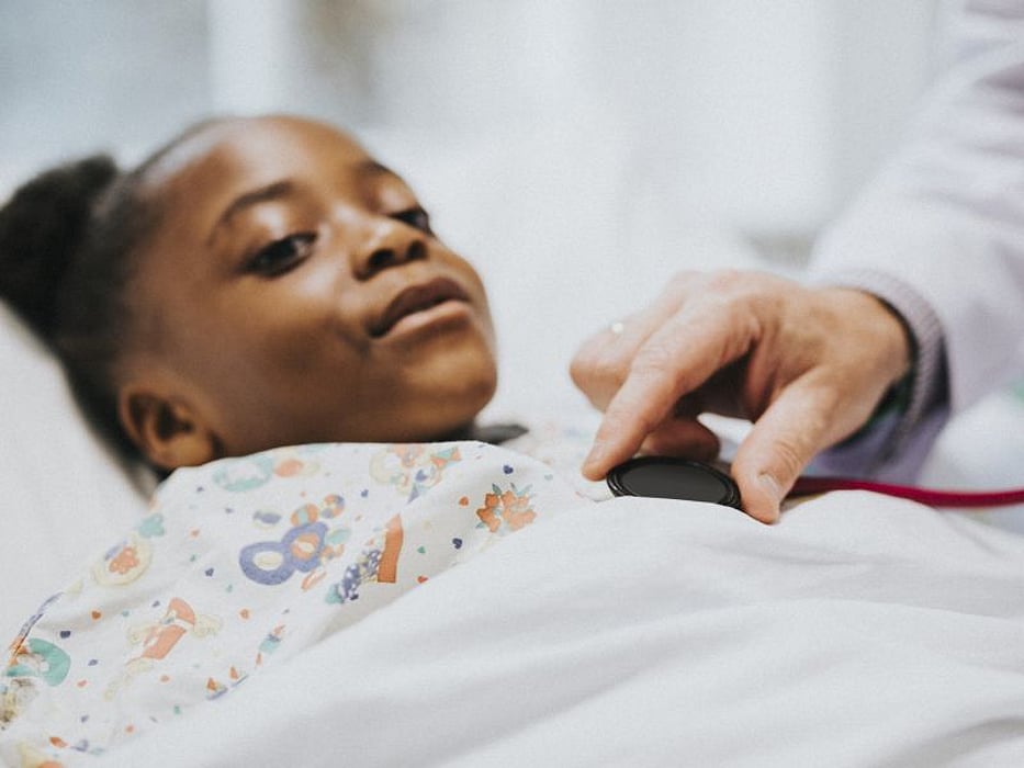 Girl in hospital bed