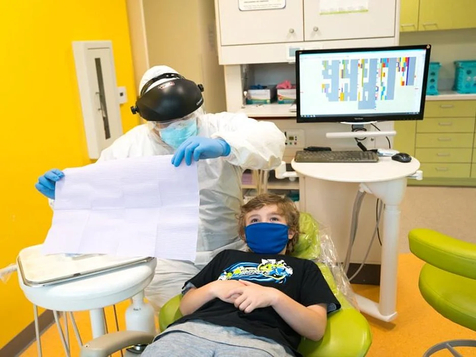 Dr. Hoss readies a young patient