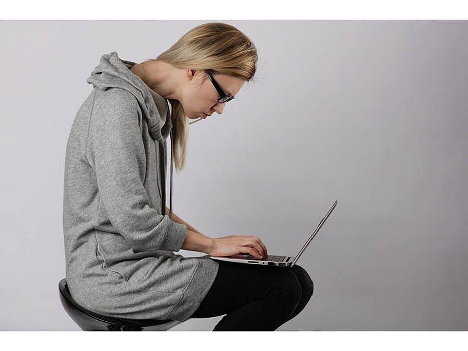 woman slouching while using computer
