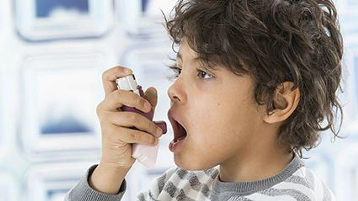 a kid with a inhaler