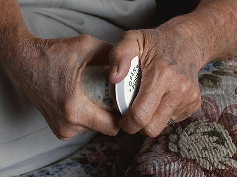 opening prescription bottle
