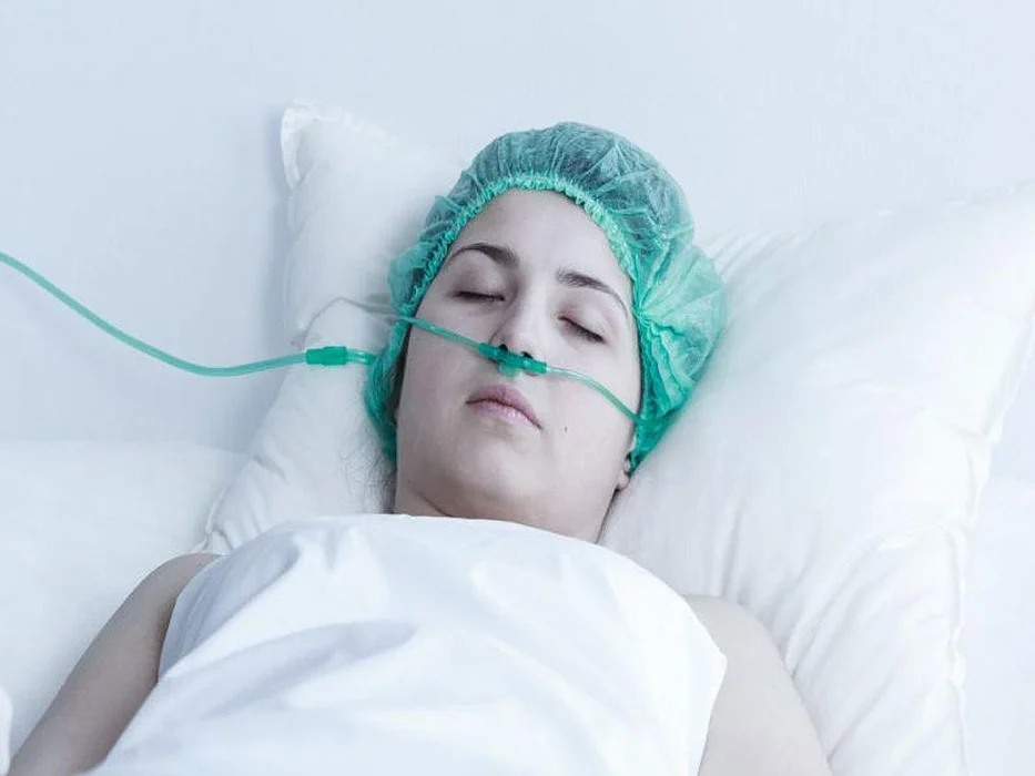 female in coma