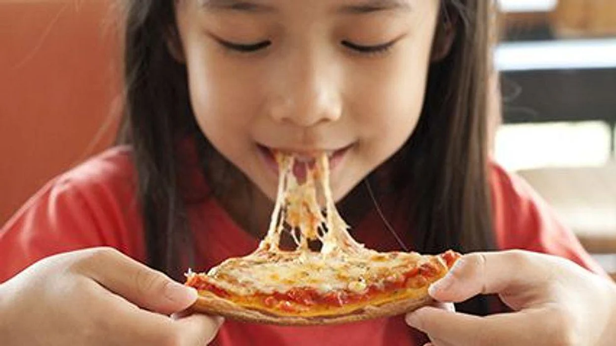 a child eating pasta