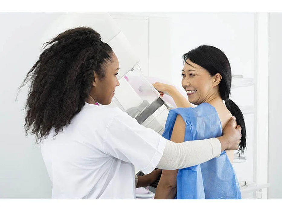 asian woman getting mammogram