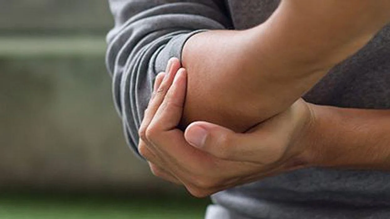 a person holding his arm