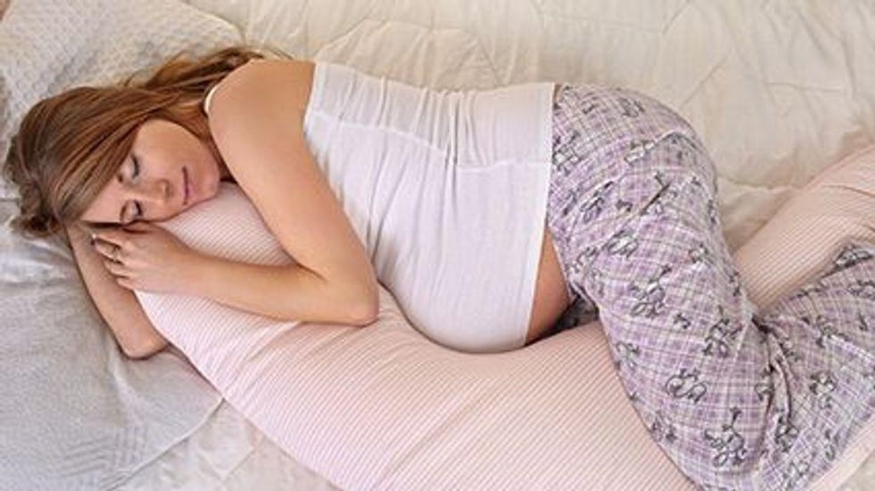 a pregnant woman sleeping