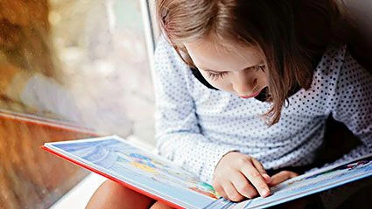 a girl reading a book