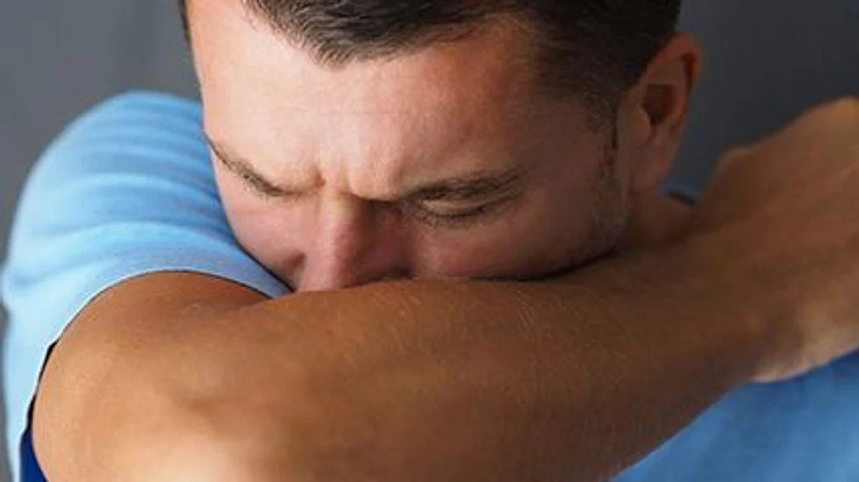 a man sneezing