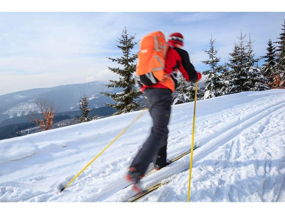 man ski walking in the winter outdoors
