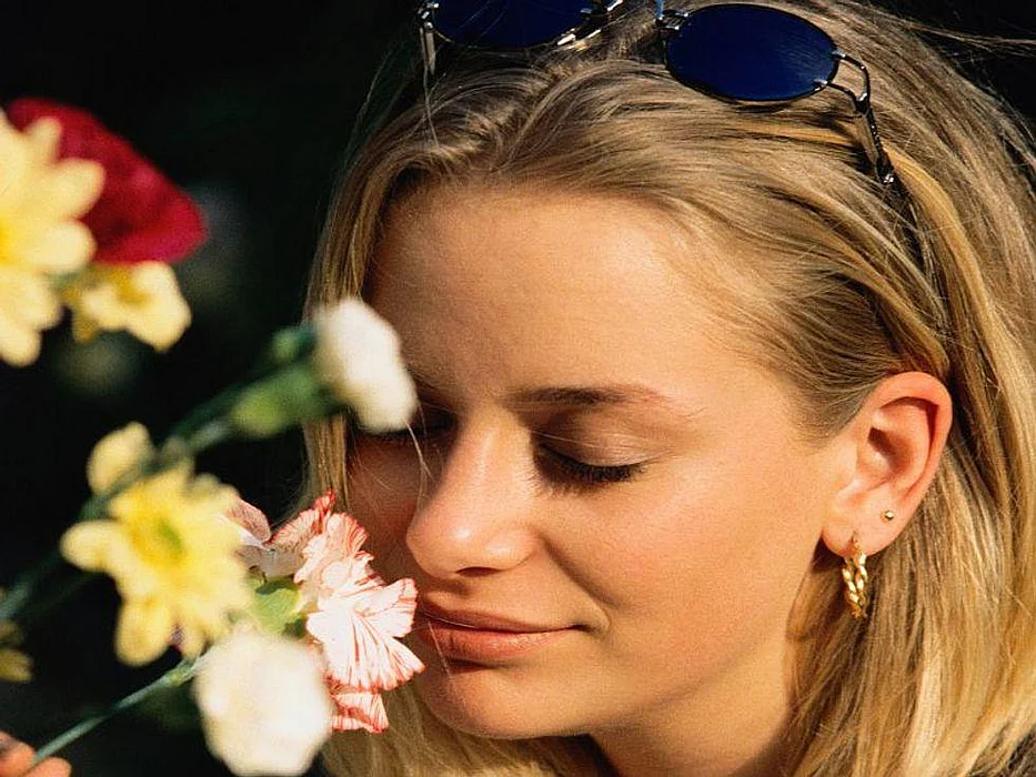 smelling flowers