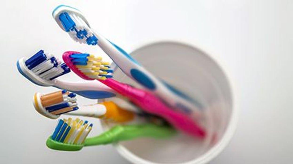 a bunch of toothbrushes in a cup