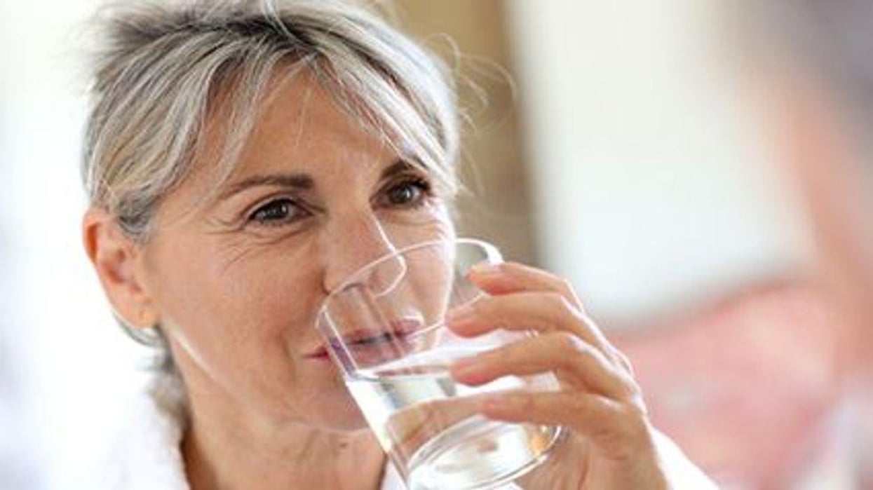 older woman drinking water