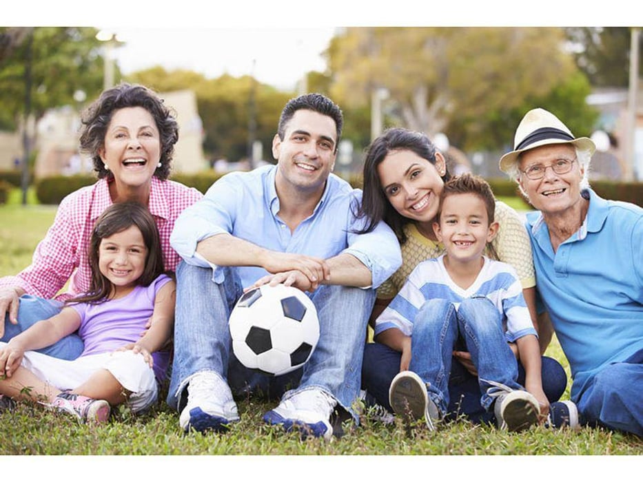 family with soccer ball outdoors