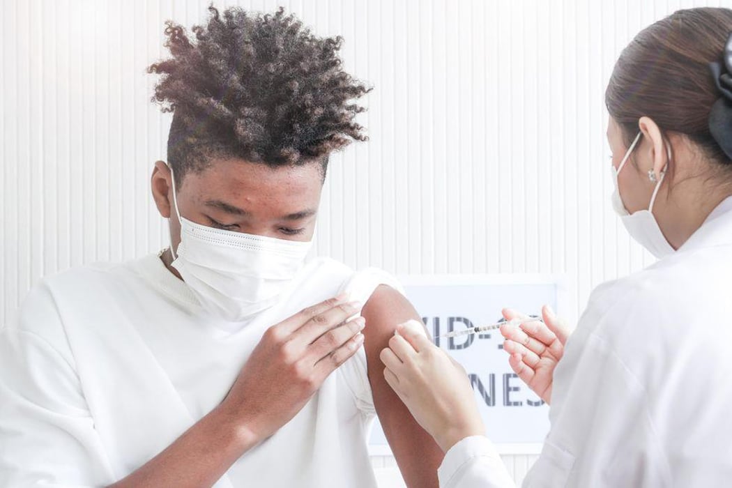 black teen getting vaccine