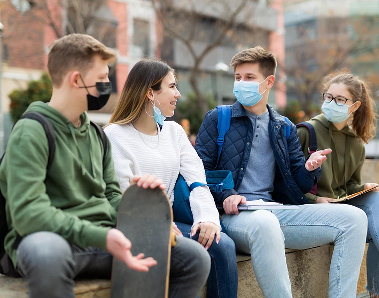 Keep Wearing Masks a While Longer, CDC Director Says