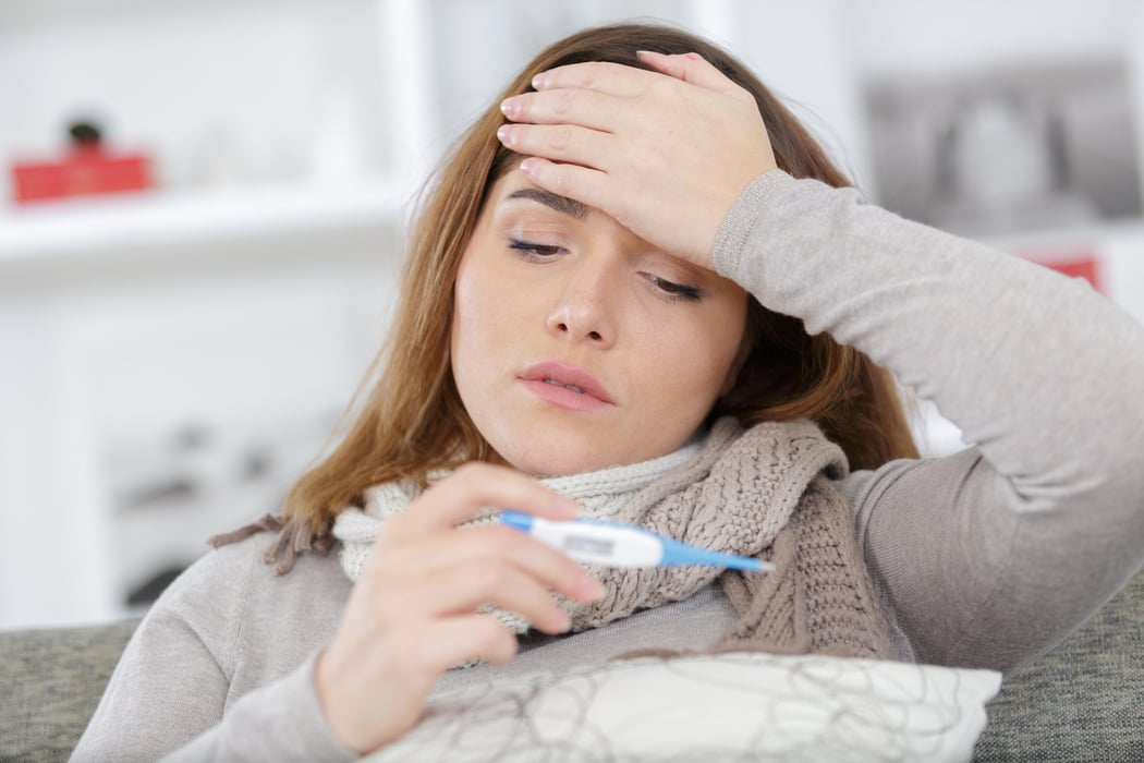 a woman is very sick cold flu